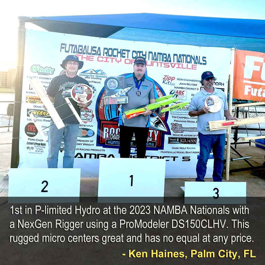 Close up of modelers on the podium of a model toy boat competition where modeler Ken Haines of Palm City, FL took 1st in P-limited Hydro at the 2023 NAMBA Nationals with a NexGen Rigger using a ProModeler DS150CLHV. This rugged micro centers great and has no equal at any price.