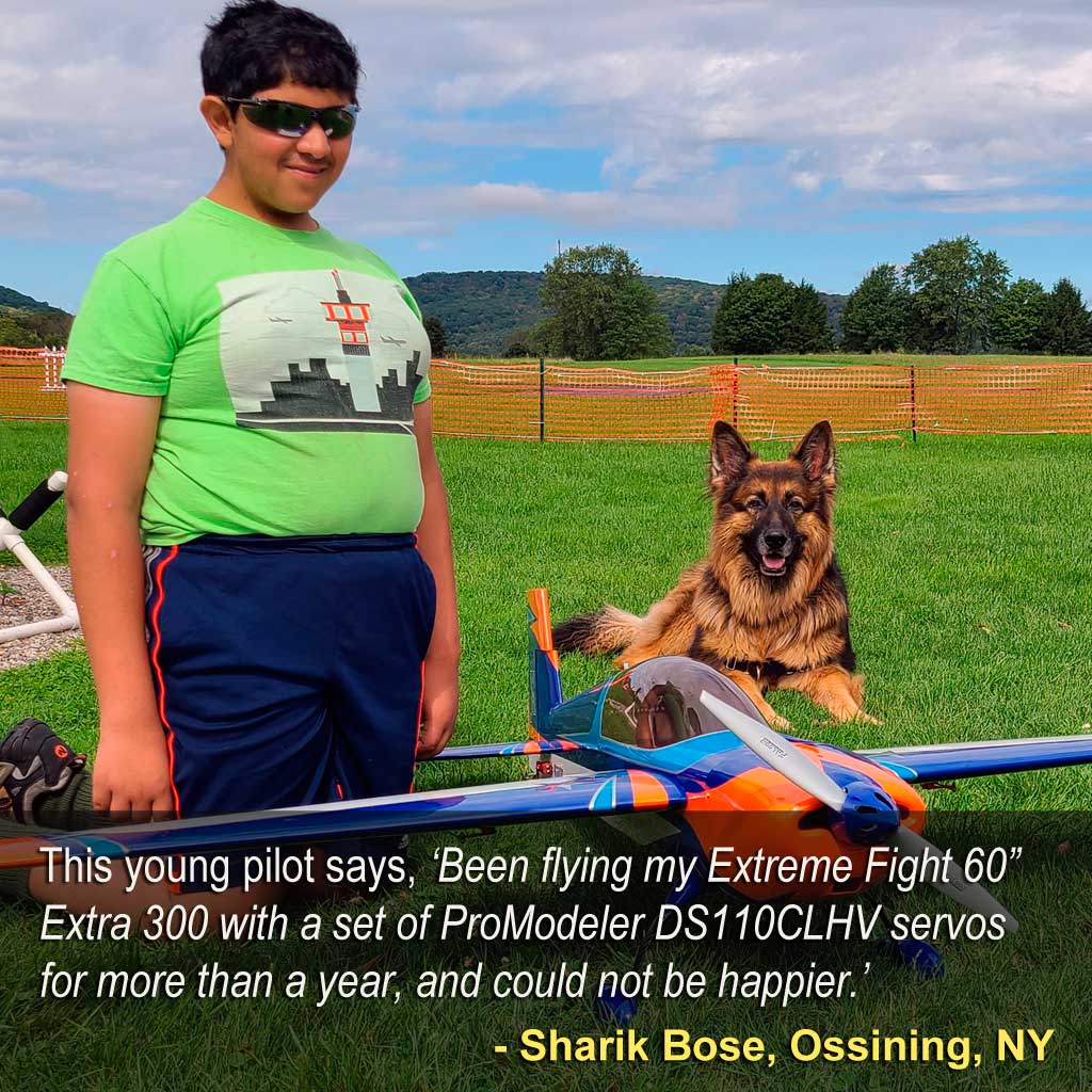 Close up of Sharik Bose of Ossining, NY as this young pilot, his well trained German Shepherd besides him says about the servos in his model, ‘Been flying my Extreme Fight 60” Extra 300 with a set of ProModeler DS110CLHV servos for more than a year, and could not be happier.’