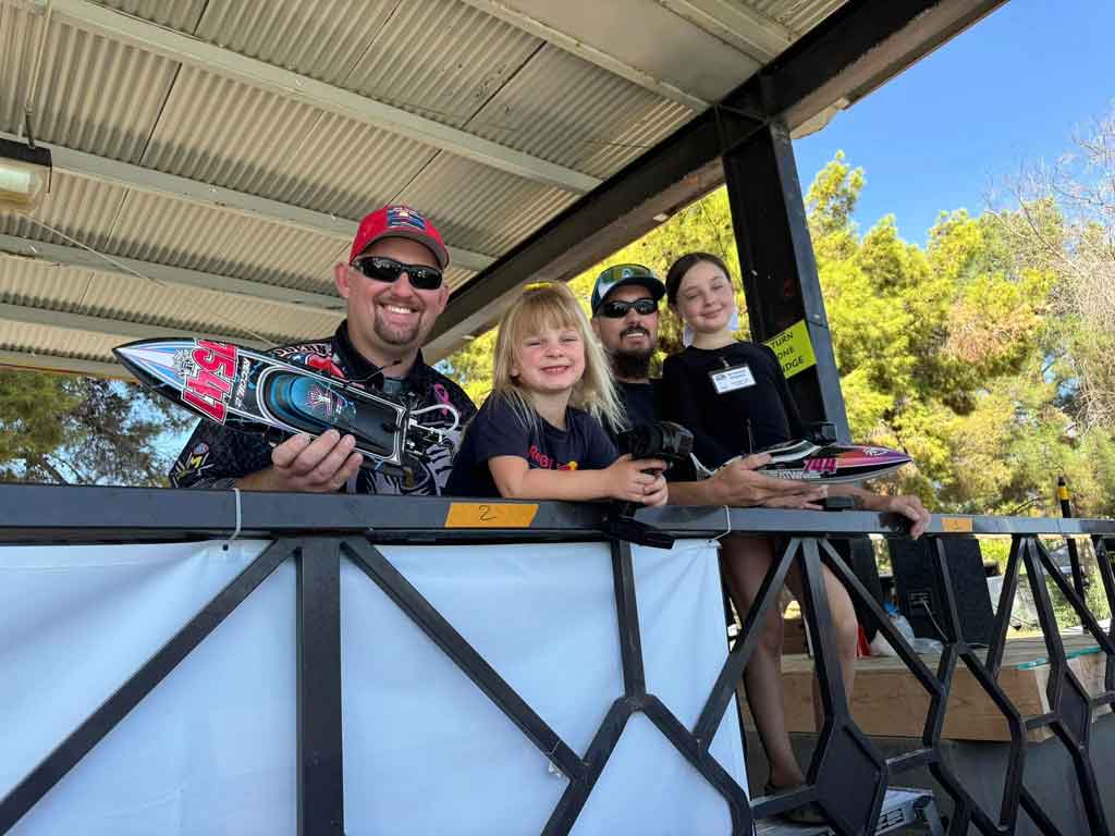 The joy is visible in both the dad's and the children's faces after winning their races.