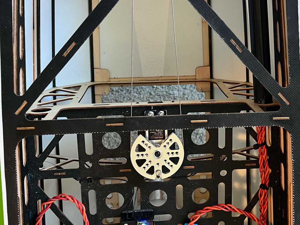 A close up look at the rudder servo and ProModeler PDRS50PP-25T pulley within an Extreme Flight 91in Extra 300V2.
