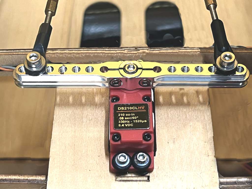Extreme close up of a double horn tiller pressed into doing pull-pull duty instead of a pulley.