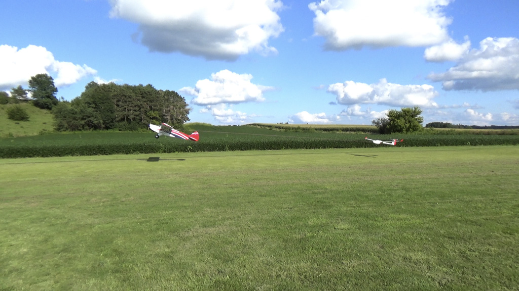 Side view photo of launch as the tug angle of attack becomes more aggressive than that of the glider