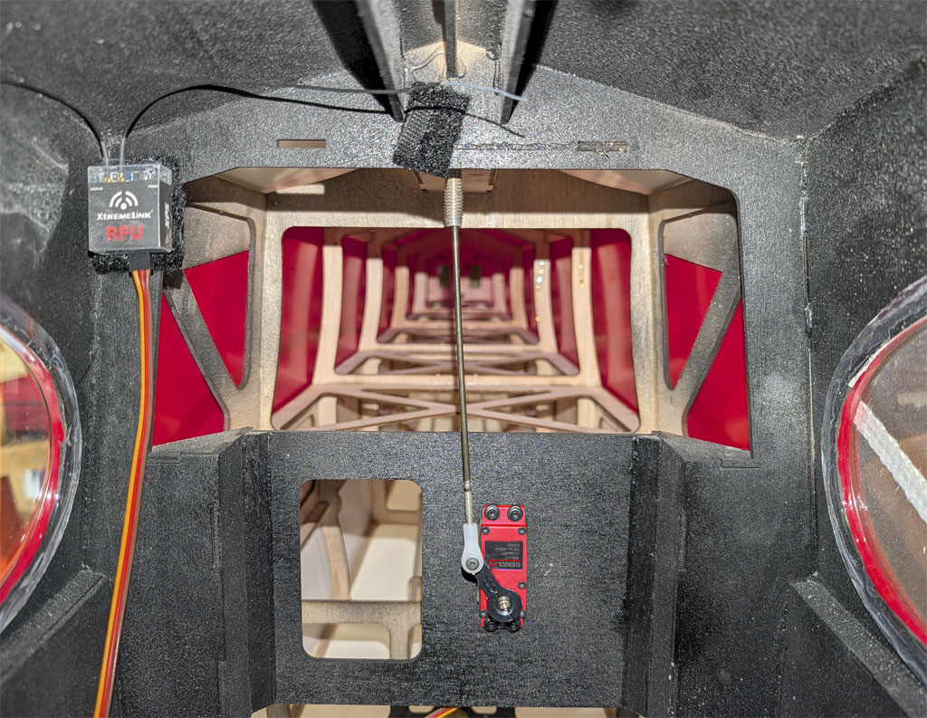 Close up photo of the internal aerotow mechanism within a Hangar 9 165-inch Carbon Cub FX-3 fuselage