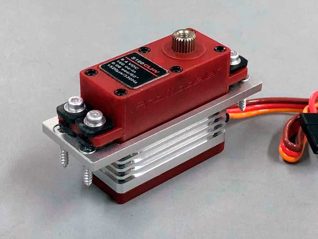 Close up photo of a ProModeler mini-class servo mounted with a an M2S mount adapter thus allowing it to be fitted in place of a standard class servo