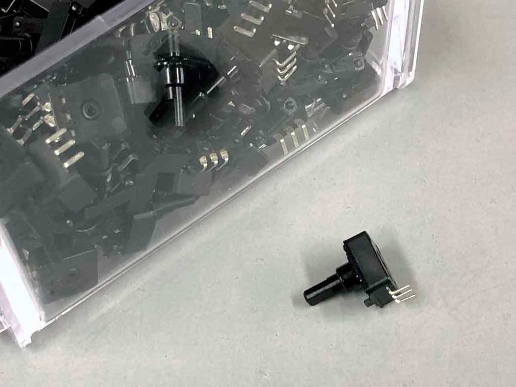 Close up photo of a bin of Nobel brand potentiometers used in ProModeler servos