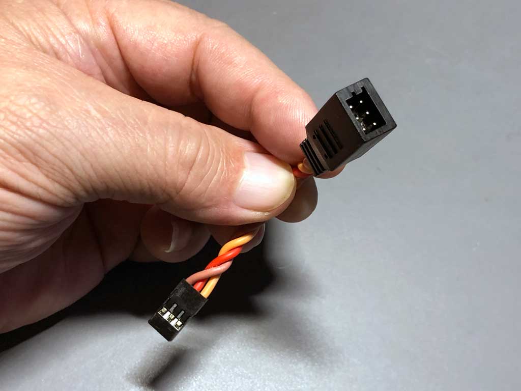 With a dual block input, the real purpose of this is to add a capacitor at the load end of an extensions but it can be used for two servos when the load won't exceed 3.5A, and with 20AWG silicone leads, this close up of the ProModeler Y-harness shows off the merits of a custom molded unit.