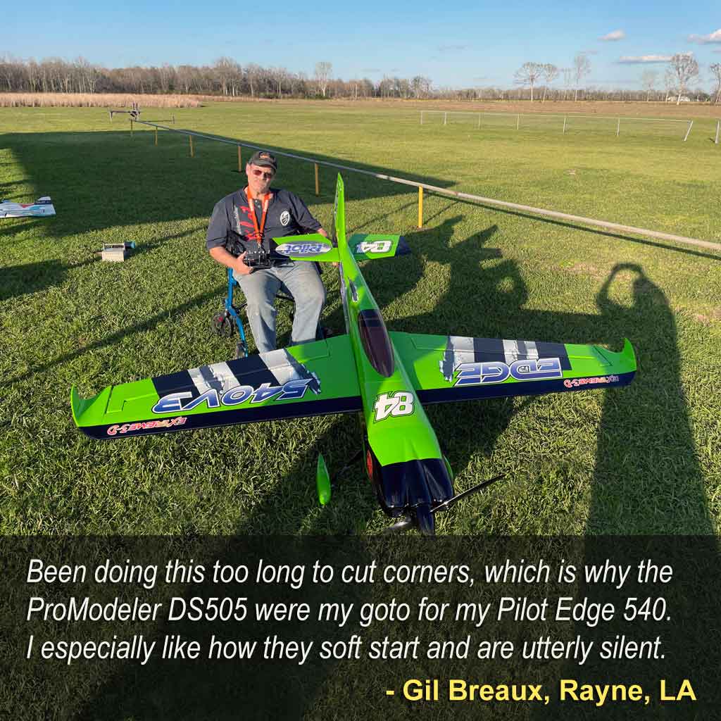Close up of seated pilot Gil Breaux, of Rayne, LA stating about his giant scale model airplane, 'Been doing this too long to cut corners, which is why the ProModeler DS505 were my goto for my Pilot Edge 540.  I especially like how they soft start and are utterly silent.'