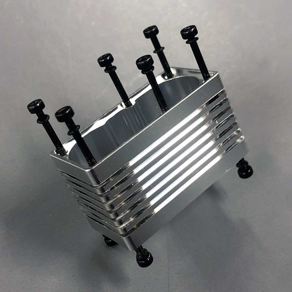 Photo of the ProModeler porcupine center case. porcupine because of the ten bolts the thread into the 6061-T6 aircraft alloy. Machined form a solid billet of aircraft alloy, this is the heart of the servo because everything is anchored to this foundation element 'and' it must shed a boat load of heat, hence the cooling fins!