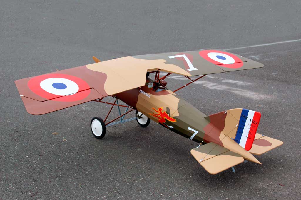 Left rear view of Seagull Models 1/3-scale Morane-Saulnier A.1 ARF model on wet asphalt.