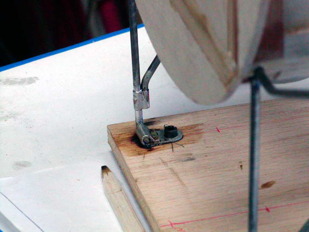Two pieces of music wire wrapped with copper wire and then soldered together into a functional landing gear or cabane strut assembly.