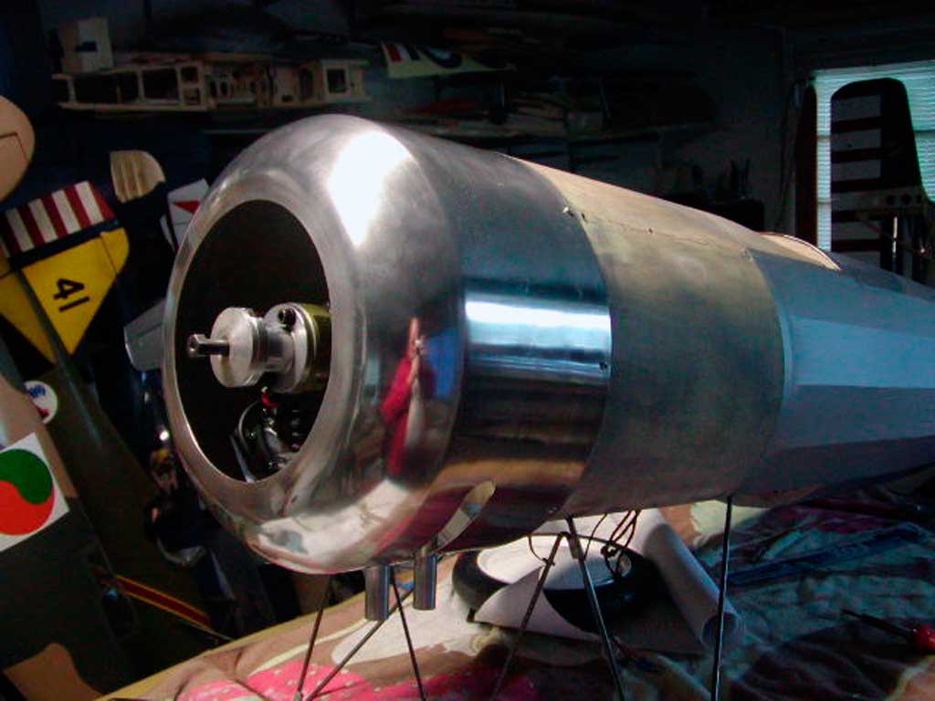 BUSA Morane-Saulnier fuselage with engine mounted and cowl fitted sitting on wire landing gear struts.