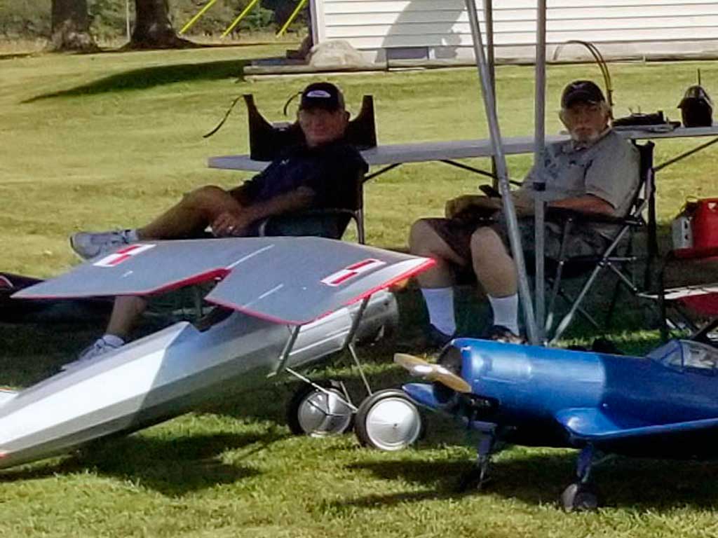 Allen Whitaker and a pal taking a break from the sun at a flying event. Denny Friesel. photo.