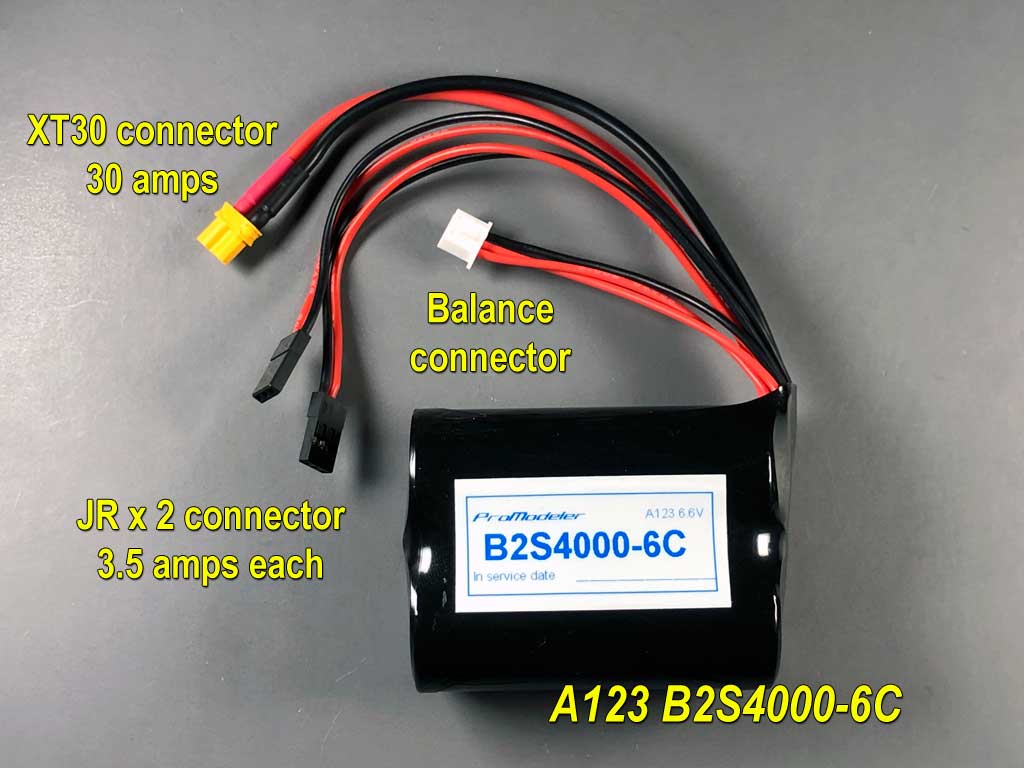 Close up of 2S A123 battery pack of 4000mAh capacity equipped with a balance connector, two DuPont connectors, and an XT30 connector.