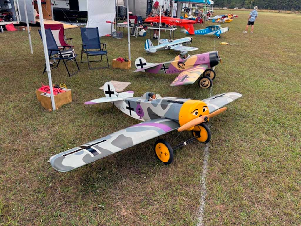 A pair of Fokker V.25 low wing monoplane models photographed at a fun fly event.