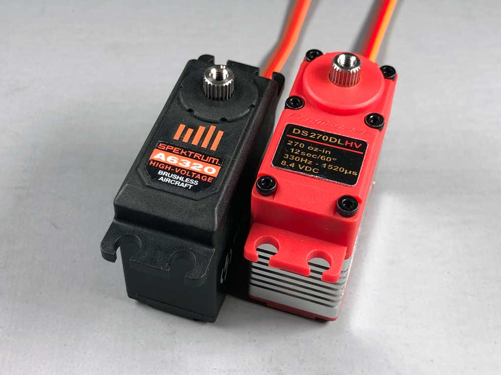 Close up of Spektrum A6320 side-by-side with ProModeler DS270DLHV standard class servo.