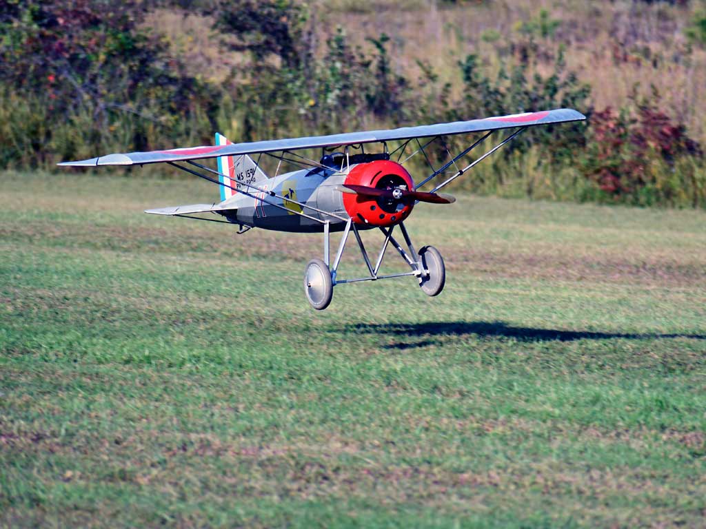 Close up shot of the BUSA Morane-Saulnier A.1 model flaring before touchdown on the grass runway at the Tullahoma, TN airport - photo by John W. Philbrick.