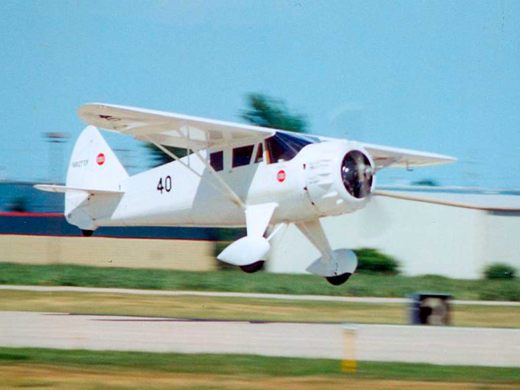 Replica of Howard DGA-6 Mister Mulligan just prior to touchdown with photo attribution to: By FlugKerl2 - Own work, CC BY-SA 3.0, https://commons.wikimedia.org/w/index.php?curid=10738884
