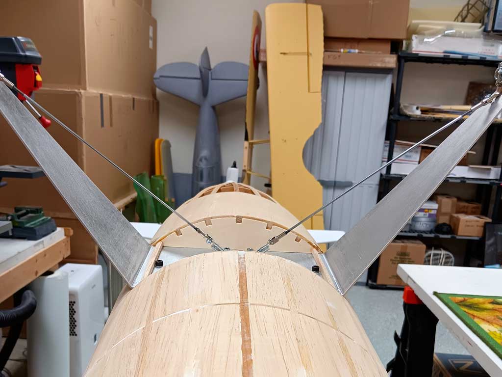 Close up of a super simple and ingenious sprung landing gear setup reinforces original alloy gear legs.