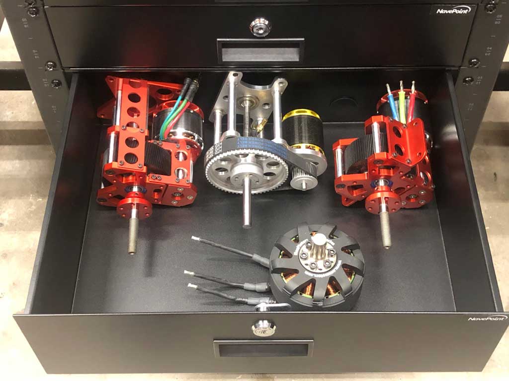Close up of a drawer filled with suitable propulsion drive units for a 12S giant scale model airplane.
