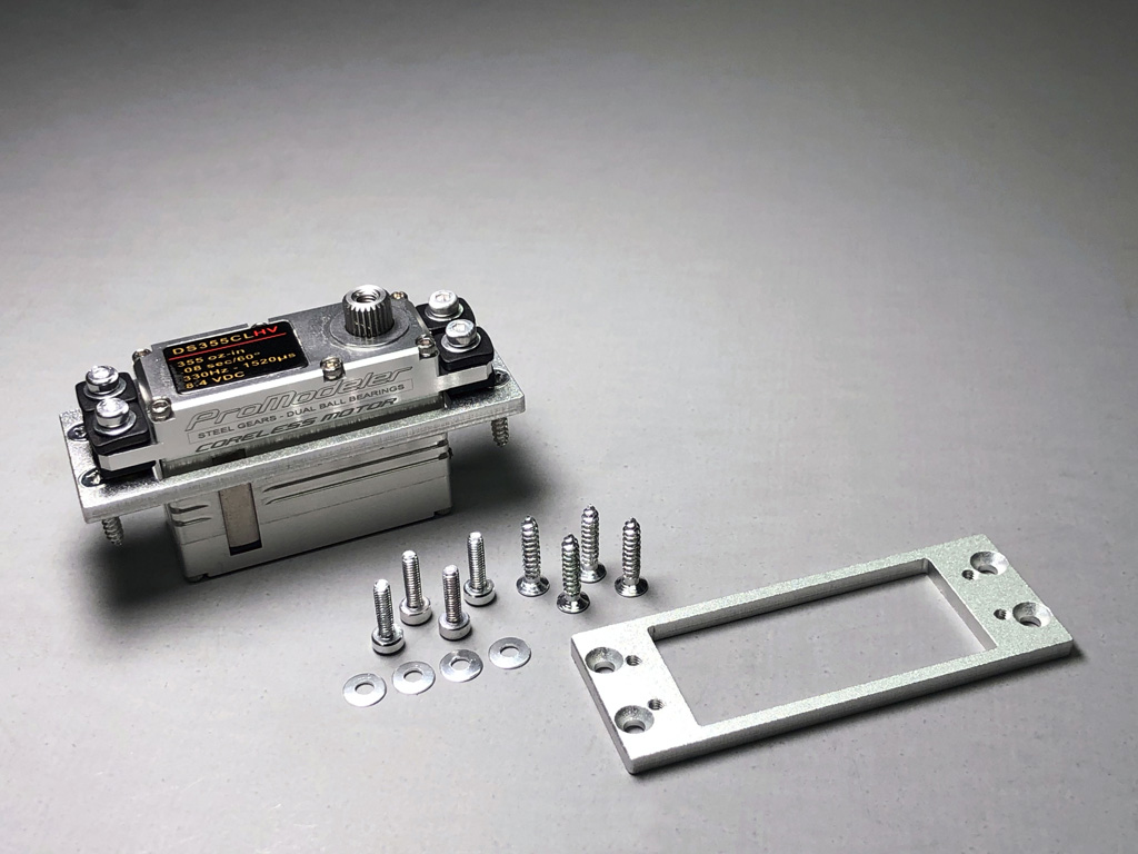 Close up photo of the PDRSM2S mount adapter required to mount mini-class servos within an Extreme Flight 85 inch Extra 300EXP in lieu of standard-class servos