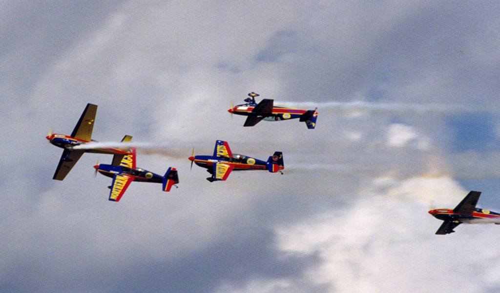 Wide angle photo of the Northern Lights demonstration team with their brightly colored Extra 300 aircraft taken by FlugKerl2
