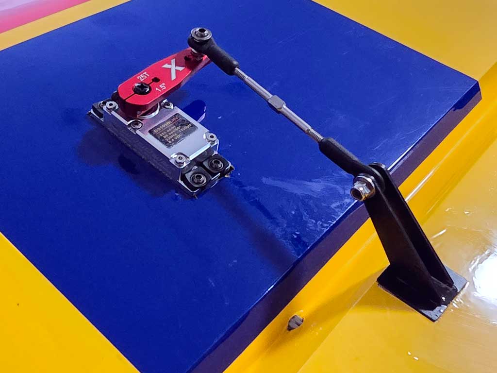 Close up photo of the aileron servo installation within an Extreme Flight 85 inch Extra 300EXP