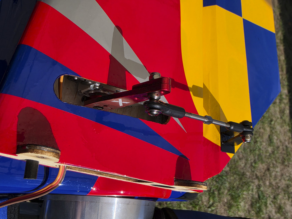 Close up photo of the elevator servo and linkage installation of an Extreme Flight 85 inch Extra 300EXP