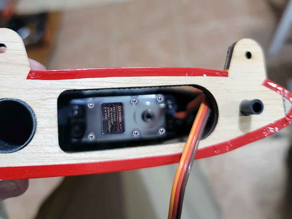 Close up photo of the elevator servo installation within an Extreme Flight 85 inch Extra 300EXP