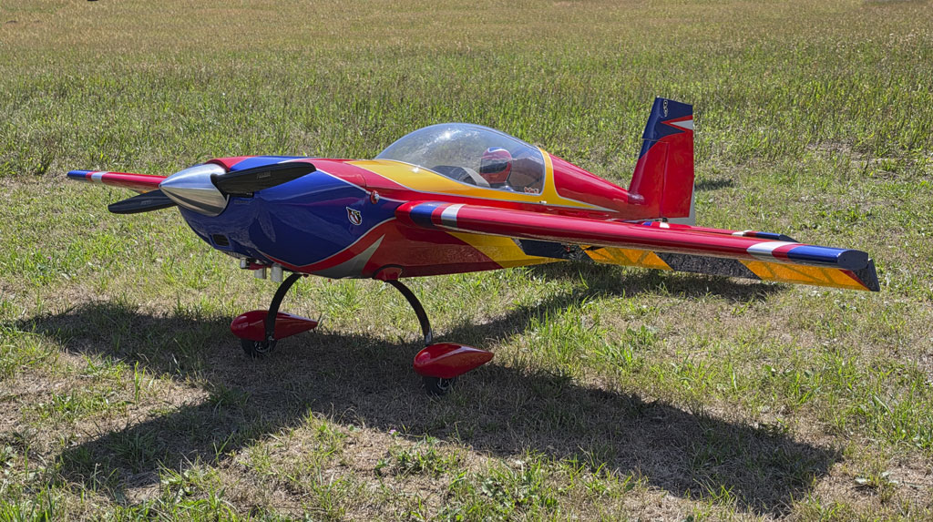 Low front quartering photo of an Extreme Flight 85 inch Extra 300EXP in a grassy field