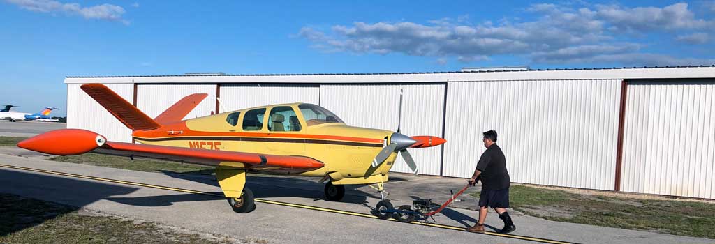 John washing his Beech Bonanza E35