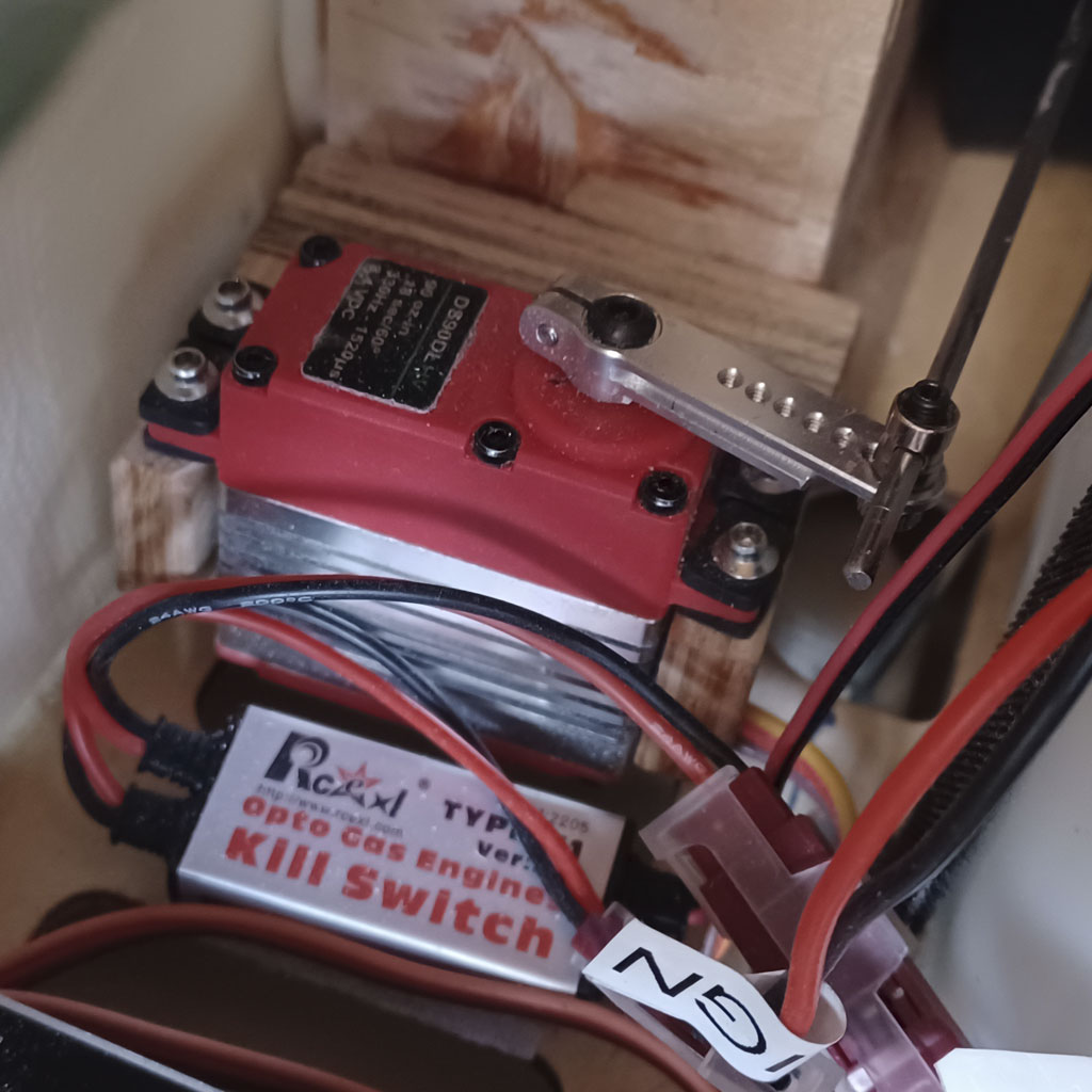 Close up photo of an RCEXL opto kill switch mounted besides a ProModeler DL-series throttle servo