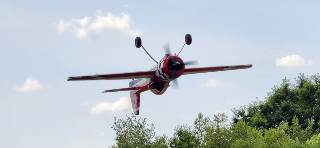 Close up photo of the Goldwing 106in Yak 55M making an inverted pass
