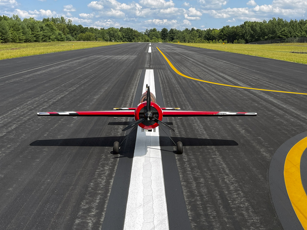 Head on photo of the Goldwing 106-inch Yak 55M out on the runway