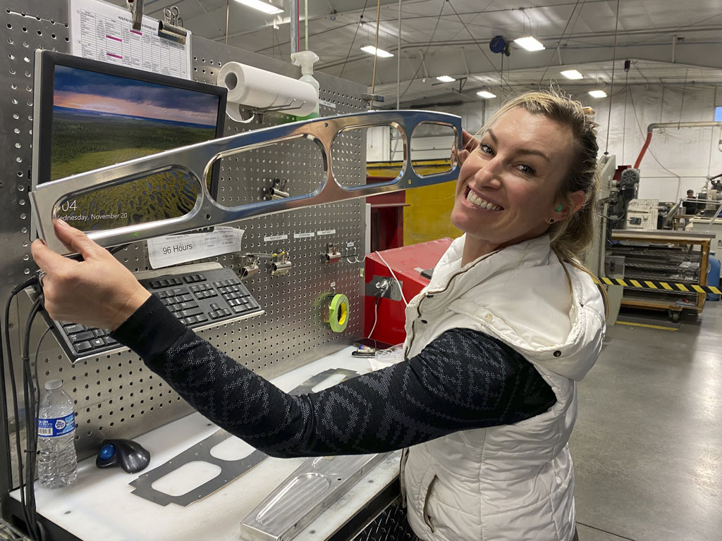 Photo of Jackie burch holding a hydro formed Cub rib she ran herself