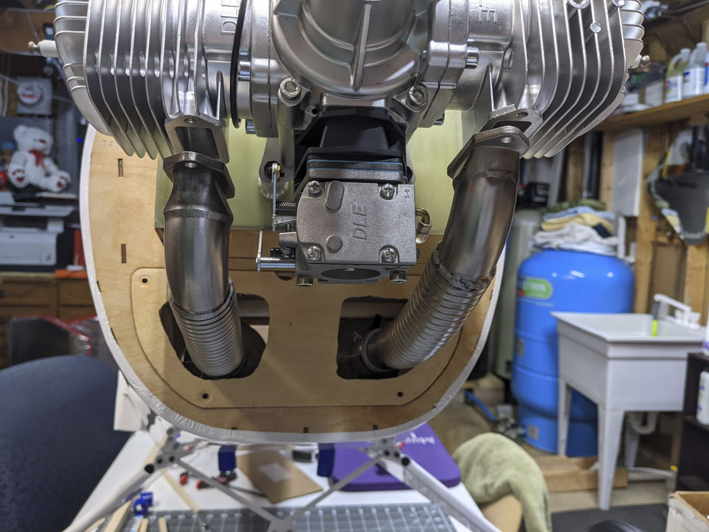 Photo of exhaust headers taking exhaust gasses aft through the fuselage
