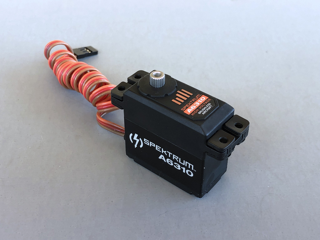Photo of Spektrum A6310 standard class servo against a gray background