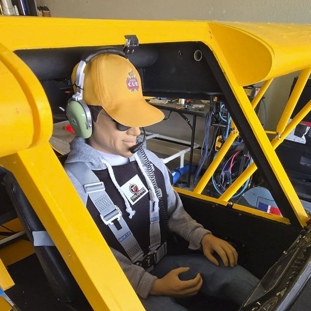 Close up photo of pilot figure in yellow Cub