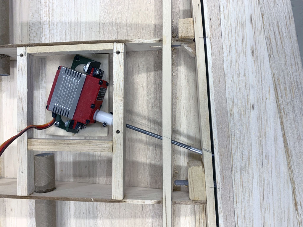 Close up photo of the wing construction of the Hostetler quarter scale Cessna 195 aileron installed using the RDS linkage