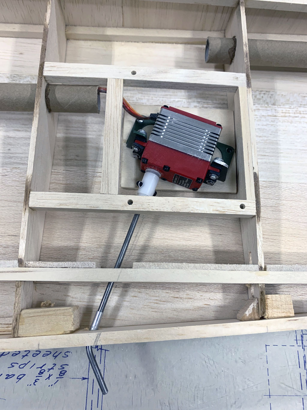 Close up photo of standard size ProModeler servo with a hidden rotary drive linkage to the control surface
