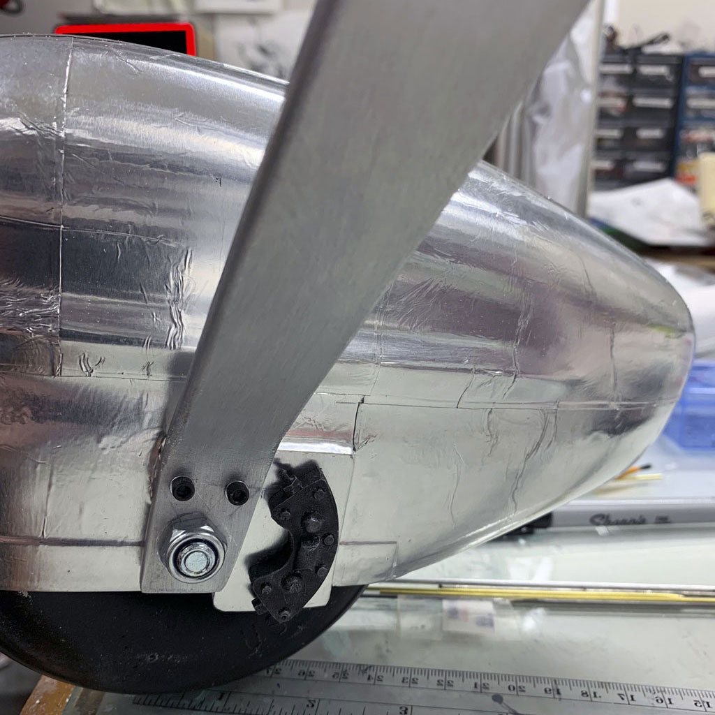Close up photo of the final asembly of the brake caliper affixed to the wheel pants of the Hostetler Cessna 195
