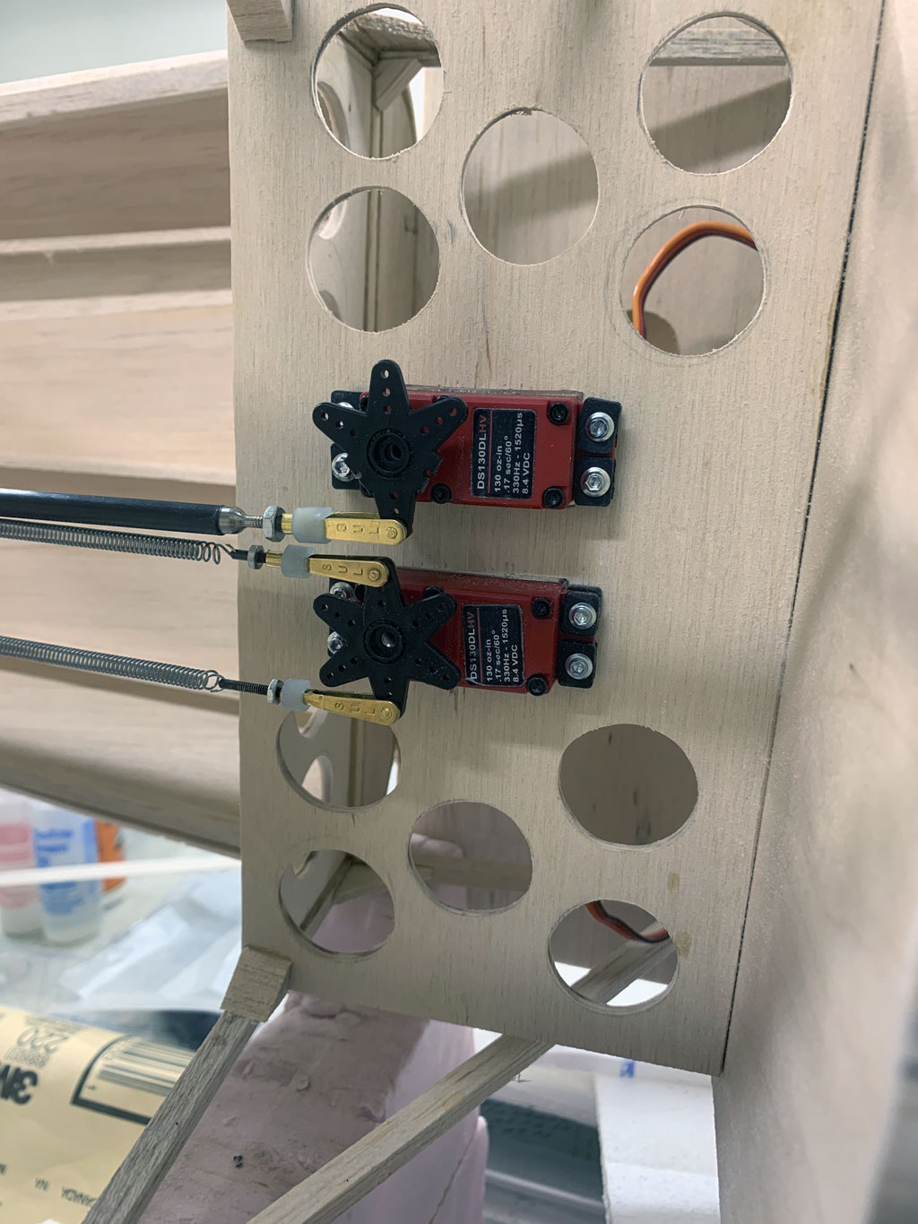 Close up photo of the aft fusleage construction of the Hostetler quarter scale Cessna 195  showing the rudder and elevator servo installation and linkages