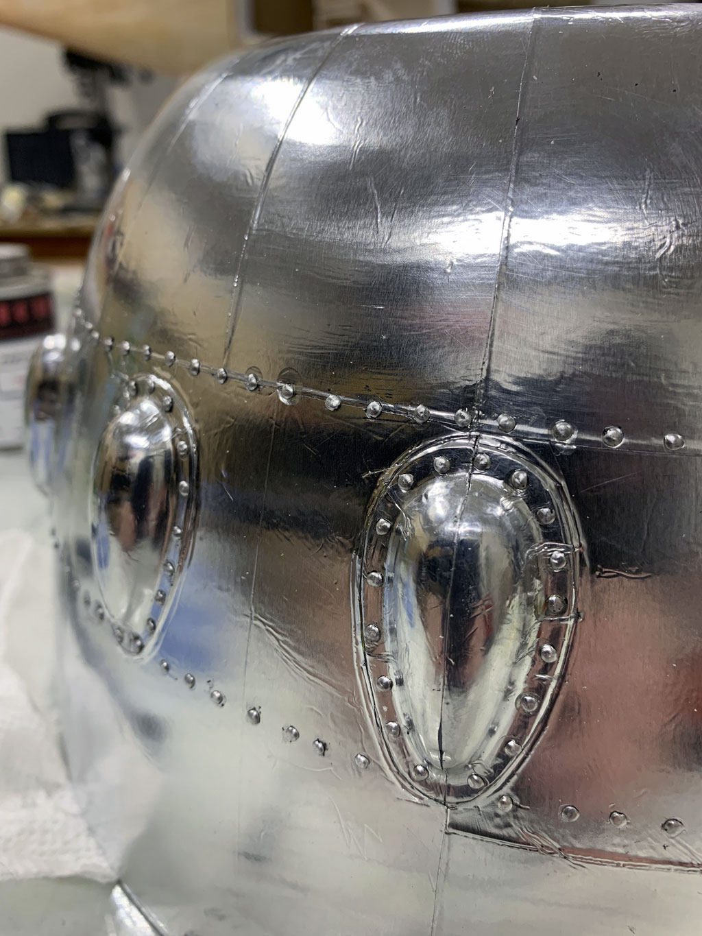 Close up photo of the cowl of the Hostetler quarter scale Cessna 195 showing final results of Flite-Metal and rivet detail