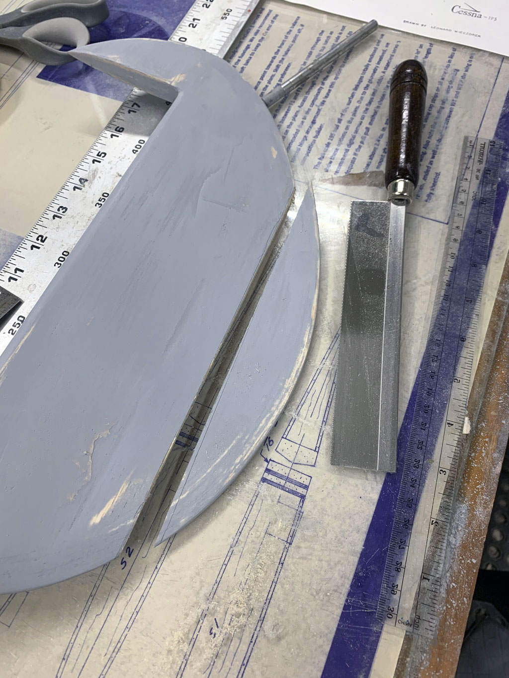 Close up photo of the stabs being detailed and covered in Flite-Metal for a Hostetler quarter scale Cessna 195 model
