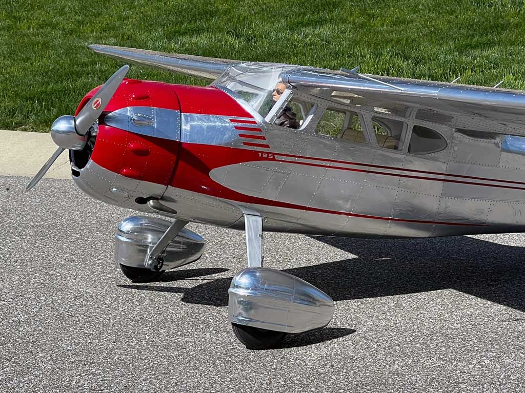 Close up photo of Hostetler quarter scale Cessna 195 showing aluminum finish