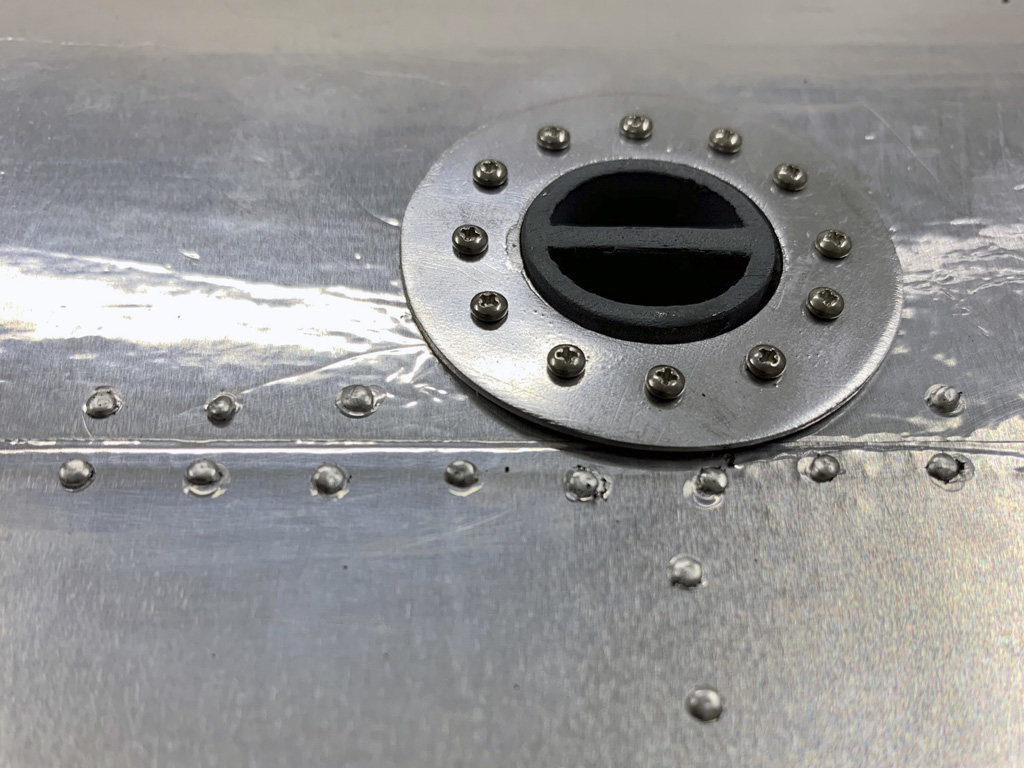 Close up photo of the wing mounted gas filler cap for the Hostetler quarter scale Cessna 195