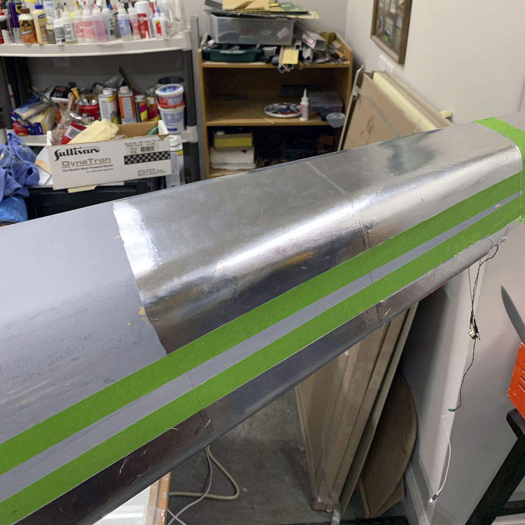 Close up photo of covering the hostetler quarter scale Cessna 195 fuselage ScaleAero's Flite-Metal genuine aluminum covering