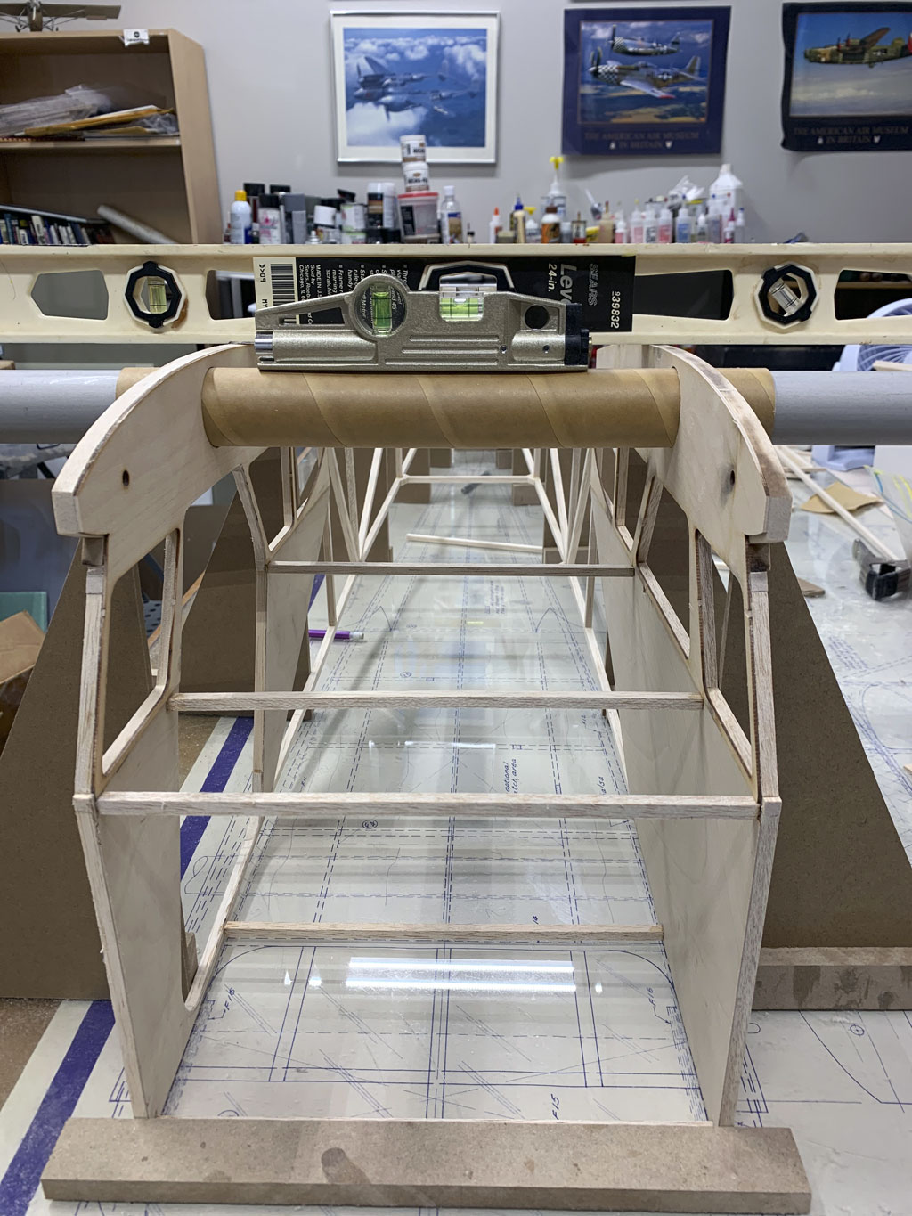 Close up photo of the fusleage construction of the Hostetler quarter scale Cessna 195 showing levels on the upper fuselage and the wing tube