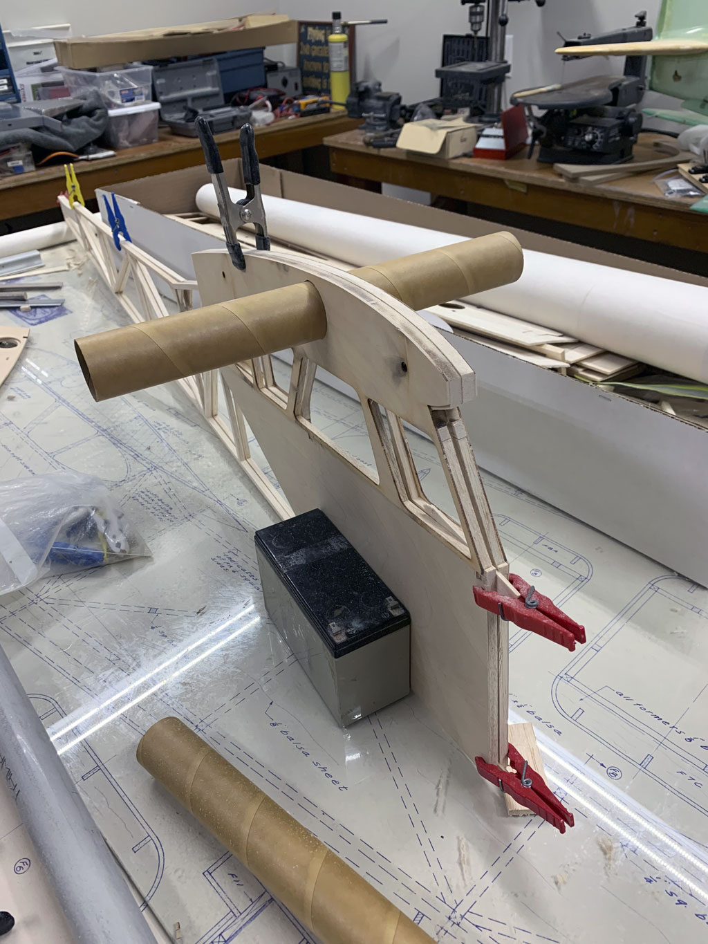 Close up photo of the fuselage construction of the Hostetler quarter scale Cessna 195 showing the two sides clamped together for inspection