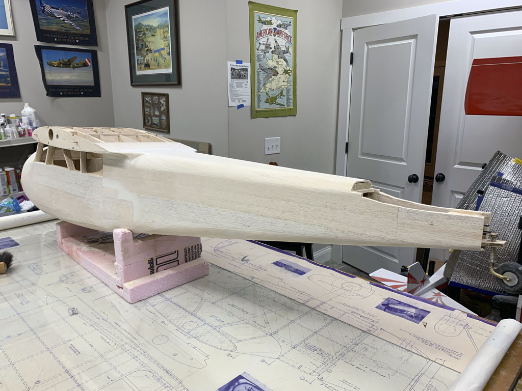 1024px hostetler quaClose up photo of the fuselage construction of the Hostetler quarter scale Cessna 195 showing the balsa sheeting on the left side