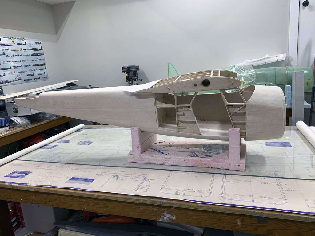 Close up photo of the fuselage construction of the Hostetler quarter scale Cessna 195 showing the balsa sheeting on the right side